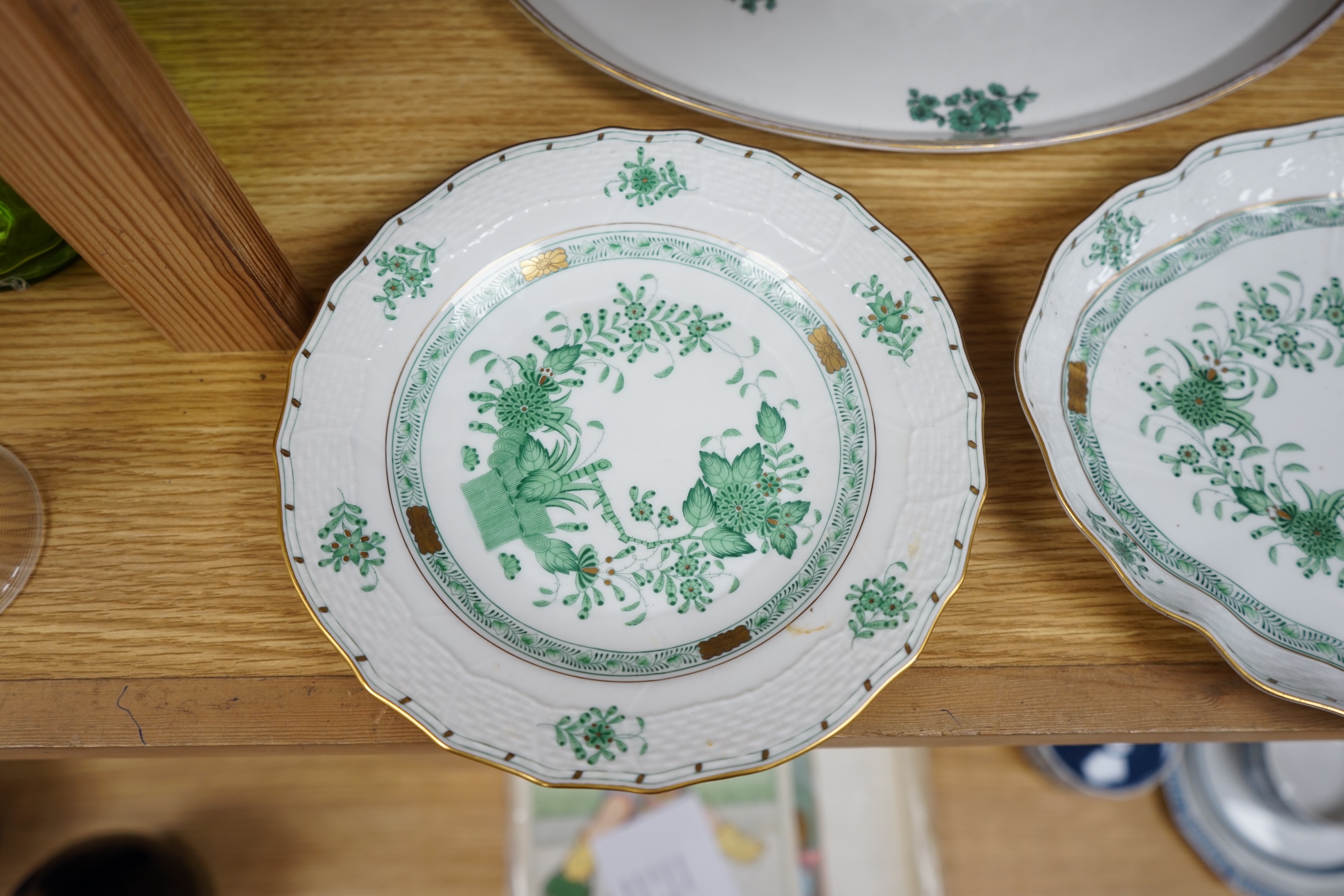 A Herend green decorated tray, 26cm wide, a similar pair of dishes and a basket, together with another larger porcelain tray, 39cm wide (5). Condition - good.